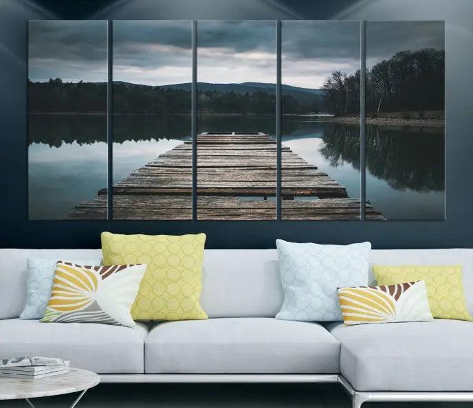 A serene triptych featuring the "Wooden Bridge Near Lake Wall Art Canvas Print" is showcased, depicting a tranquil lake with a wooden pier amidst trees and mountains on museum-quality canvas.