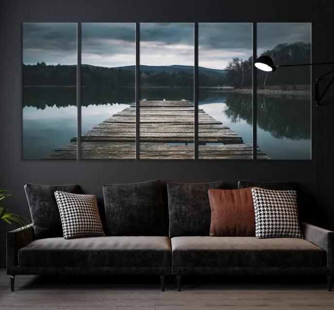 A serene triptych featuring the "Wooden Bridge Near Lake Wall Art Canvas Print" is showcased, depicting a tranquil lake with a wooden pier amidst trees and mountains on museum-quality canvas.