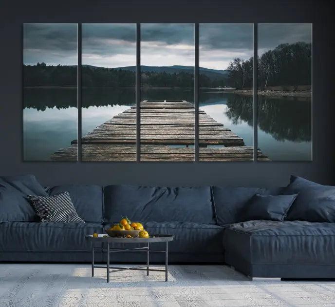 A serene triptych featuring the "Wooden Bridge Near Lake Wall Art Canvas Print" is showcased, depicting a tranquil lake with a wooden pier amidst trees and mountains on museum-quality canvas.