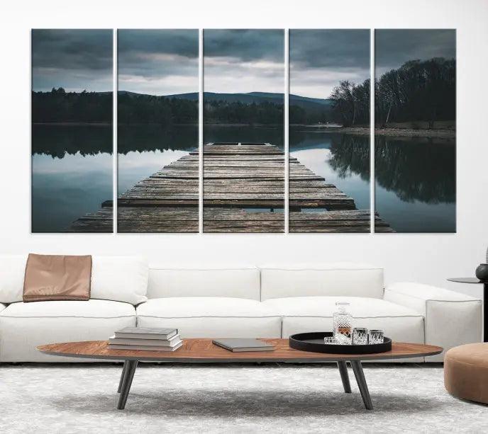 A serene triptych featuring the "Wooden Bridge Near Lake Wall Art Canvas Print" is showcased, depicting a tranquil lake with a wooden pier amidst trees and mountains on museum-quality canvas.