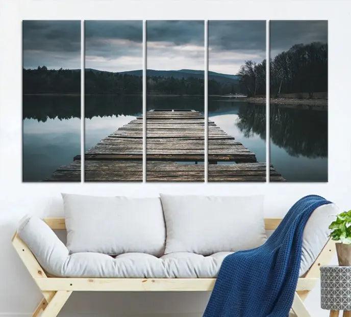 A serene triptych featuring the "Wooden Bridge Near Lake Wall Art Canvas Print" is showcased, depicting a tranquil lake with a wooden pier amidst trees and mountains on museum-quality canvas.