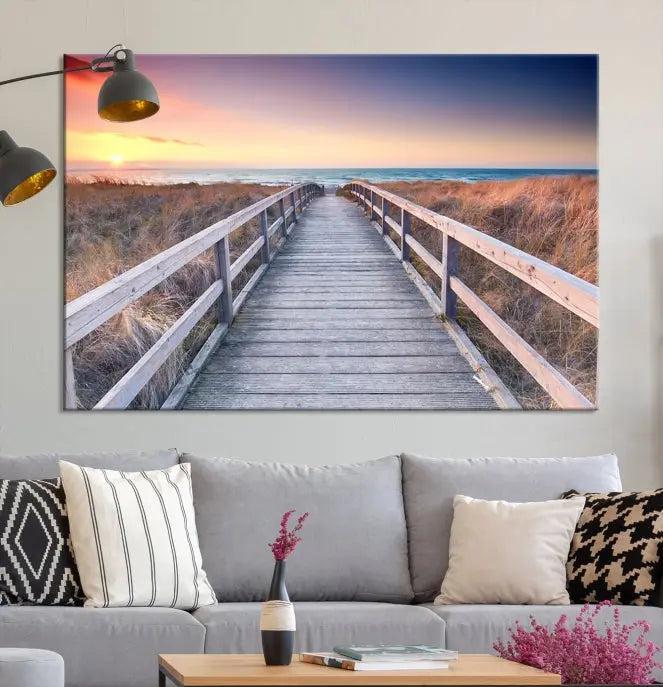 **Title:** Wooden Path at Baltic Sea Wall Art Canvas Print

**Description:** A triptych depicting a wooden boardwalk leading to a beach at sunset. This museum-quality canvas is ready to hang, offering an effortless enhancement to your decor.