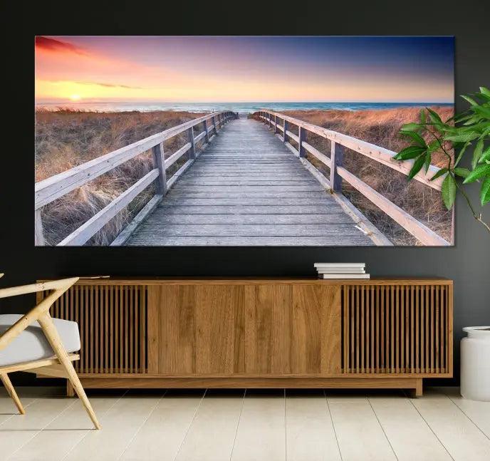 **Title:** Wooden Path at Baltic Sea Wall Art Canvas Print

**Description:** A triptych depicting a wooden boardwalk leading to a beach at sunset. This museum-quality canvas is ready to hang, offering an effortless enhancement to your decor.