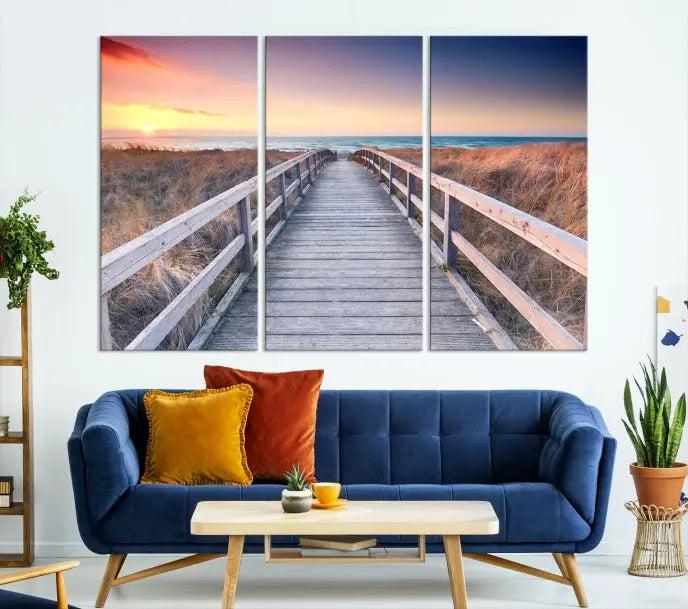 **Title:** Wooden Path at Baltic Sea Wall Art Canvas Print

**Description:** A triptych depicting a wooden boardwalk leading to a beach at sunset. This museum-quality canvas is ready to hang, offering an effortless enhancement to your decor.