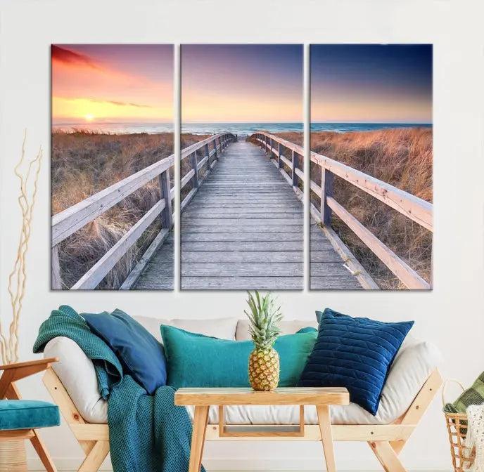 **Title:** Wooden Path at Baltic Sea Wall Art Canvas Print

**Description:** A triptych depicting a wooden boardwalk leading to a beach at sunset. This museum-quality canvas is ready to hang, offering an effortless enhancement to your decor.