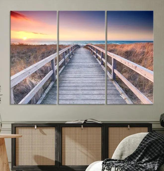 **Title:** Wooden Path at Baltic Sea Wall Art Canvas Print

**Description:** A triptych depicting a wooden boardwalk leading to a beach at sunset. This museum-quality canvas is ready to hang, offering an effortless enhancement to your decor.