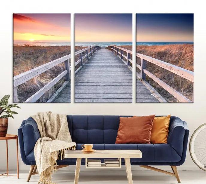 **Title:** Wooden Path at Baltic Sea Wall Art Canvas Print

**Description:** A triptych depicting a wooden boardwalk leading to a beach at sunset. This museum-quality canvas is ready to hang, offering an effortless enhancement to your decor.