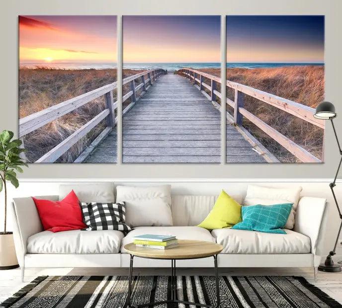 **Title:** Wooden Path at Baltic Sea Wall Art Canvas Print

**Description:** A triptych depicting a wooden boardwalk leading to a beach at sunset. This museum-quality canvas is ready to hang, offering an effortless enhancement to your decor.