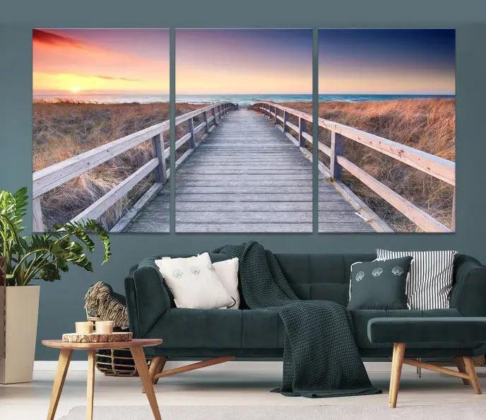 **Title:** Wooden Path at Baltic Sea Wall Art Canvas Print

**Description:** A triptych depicting a wooden boardwalk leading to a beach at sunset. This museum-quality canvas is ready to hang, offering an effortless enhancement to your decor.