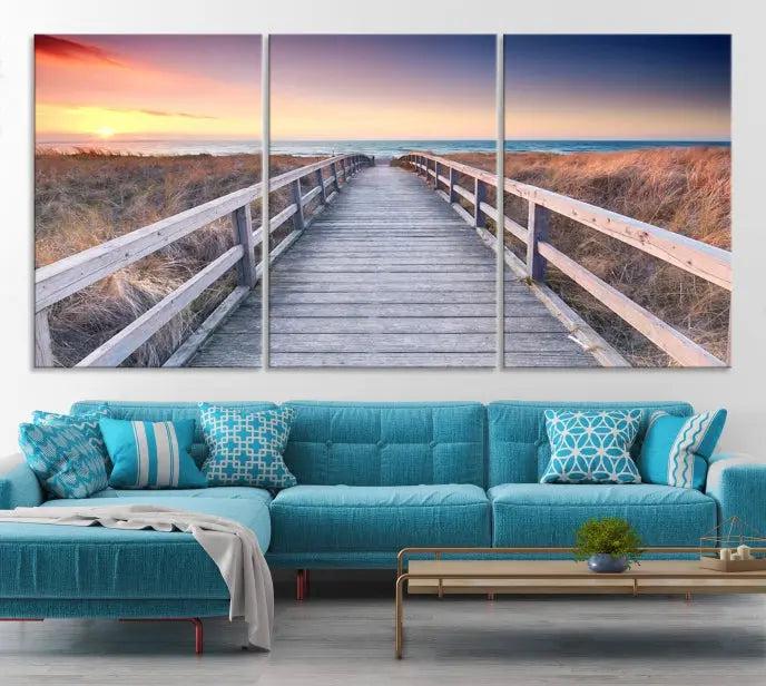 **Title:** Wooden Path at Baltic Sea Wall Art Canvas Print

**Description:** A triptych depicting a wooden boardwalk leading to a beach at sunset. This museum-quality canvas is ready to hang, offering an effortless enhancement to your decor.