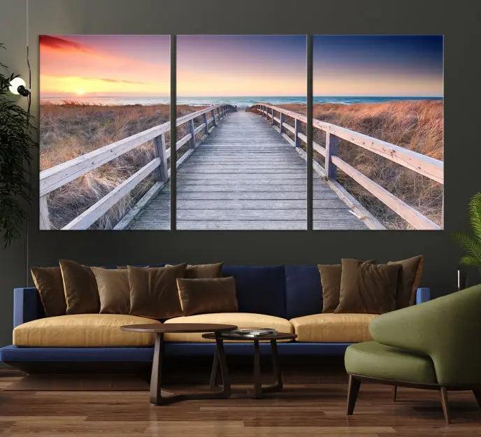 **Title:** Wooden Path at Baltic Sea Wall Art Canvas Print

**Description:** A triptych depicting a wooden boardwalk leading to a beach at sunset. This museum-quality canvas is ready to hang, offering an effortless enhancement to your decor.