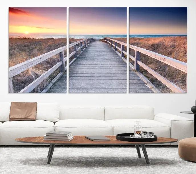 **Title:** Wooden Path at Baltic Sea Wall Art Canvas Print

**Description:** A triptych depicting a wooden boardwalk leading to a beach at sunset. This museum-quality canvas is ready to hang, offering an effortless enhancement to your decor.