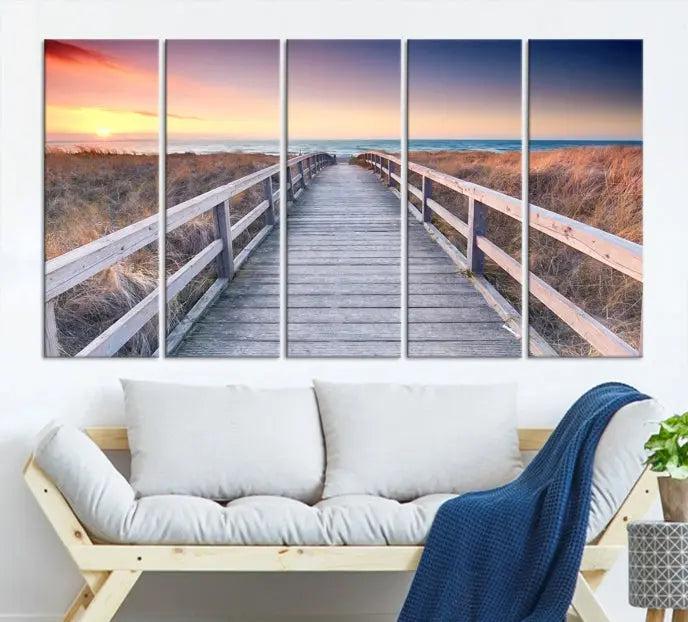 **Title:** Wooden Path at Baltic Sea Wall Art Canvas Print

**Description:** A triptych depicting a wooden boardwalk leading to a beach at sunset. This museum-quality canvas is ready to hang, offering an effortless enhancement to your decor.