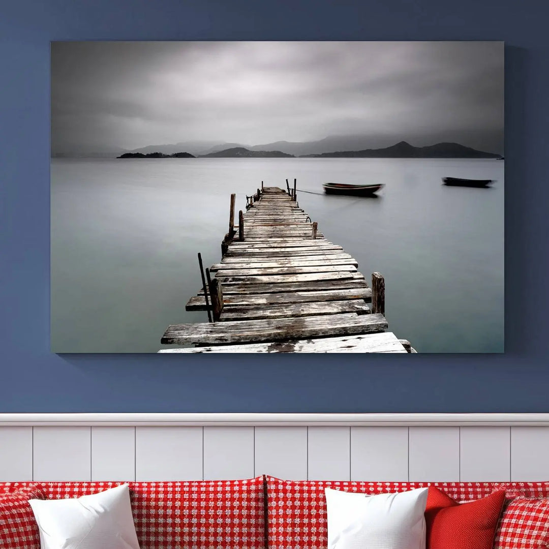 A serene triptych featuring a wooden pier stretching into misty waters brings the Wooden Pier Canvas Wall Art Beach Canvas Artwork Print to life.