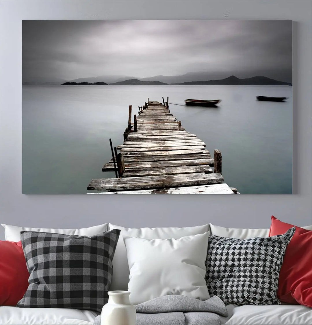 A serene triptych featuring a wooden pier stretching into misty waters brings the Wooden Pier Canvas Wall Art Beach Canvas Artwork Print to life.