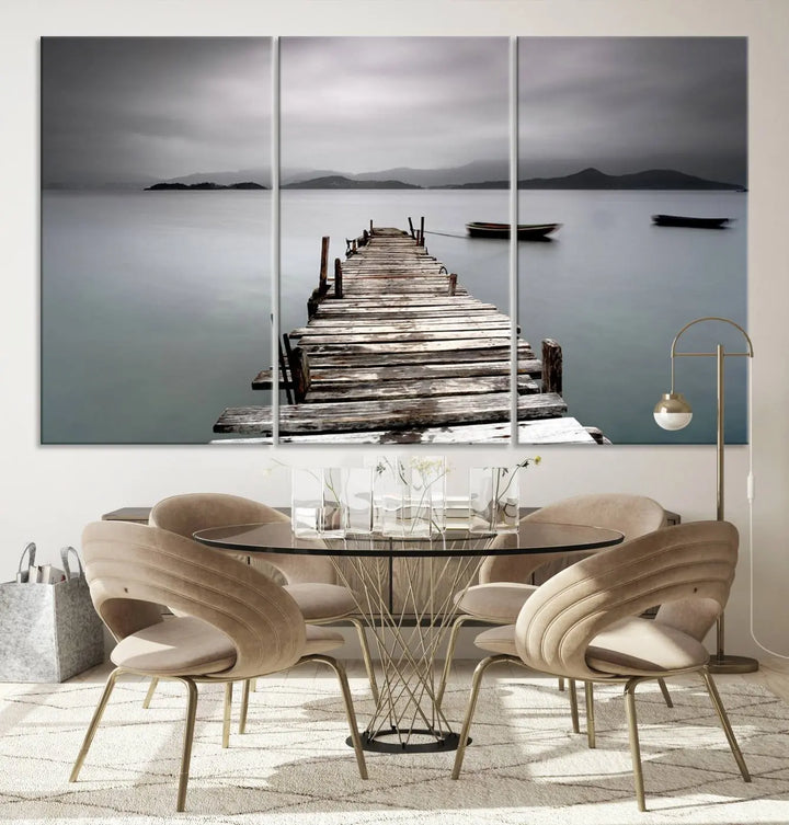 A serene triptych featuring a wooden pier stretching into misty waters brings the Wooden Pier Canvas Wall Art Beach Canvas Artwork Print to life.