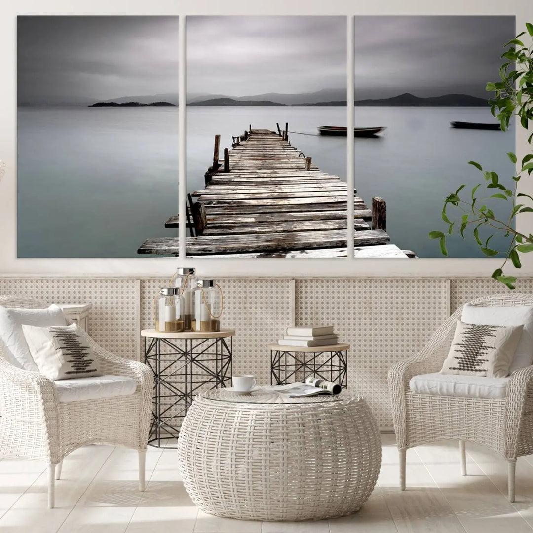 A serene triptych featuring a wooden pier stretching into misty waters brings the Wooden Pier Canvas Wall Art Beach Canvas Artwork Print to life.