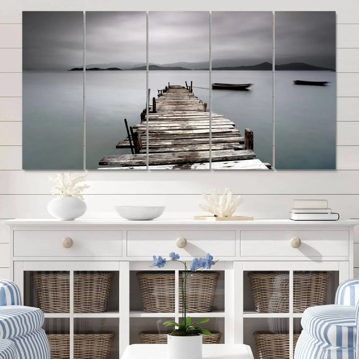 A serene triptych featuring a wooden pier stretching into misty waters brings the Wooden Pier Canvas Wall Art Beach Canvas Artwork Print to life.