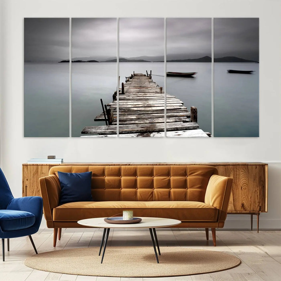 A serene triptych featuring a wooden pier stretching into misty waters brings the Wooden Pier Canvas Wall Art Beach Canvas Artwork Print to life.