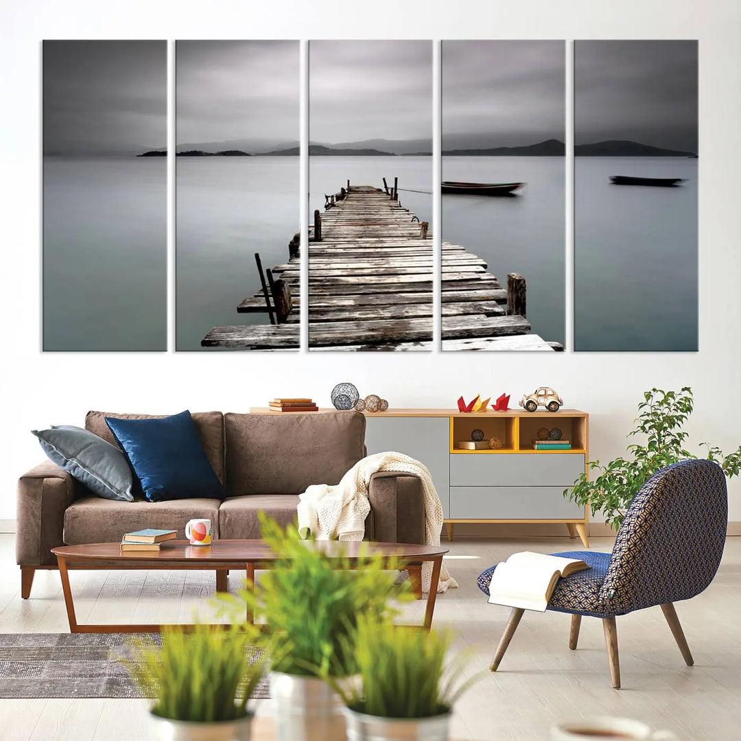 A serene triptych featuring a wooden pier stretching into misty waters brings the Wooden Pier Canvas Wall Art Beach Canvas Artwork Print to life.