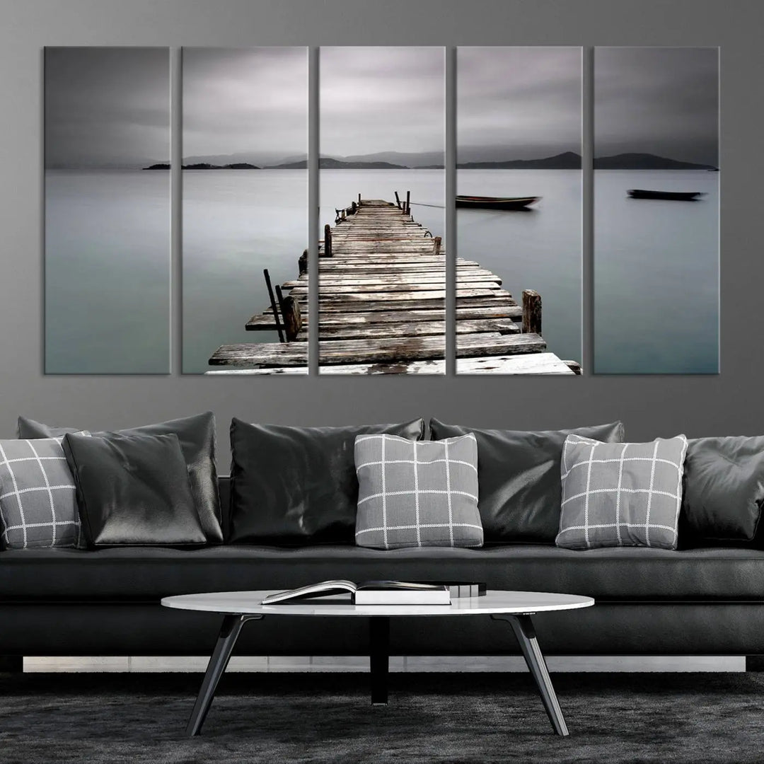 A serene triptych featuring a wooden pier stretching into misty waters brings the Wooden Pier Canvas Wall Art Beach Canvas Artwork Print to life.