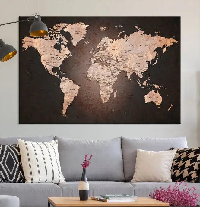 A World Map Canvas Print with a vintage design enhances the dark wall. This three-panel artwork is crafted on museum-quality canvases, gallery wrapped, and features a UV-protective coating for enduring brilliance.