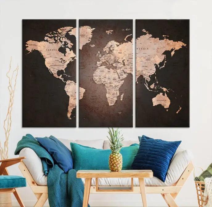 A World Map Canvas Print with a vintage design enhances the dark wall. This three-panel artwork is crafted on museum-quality canvases, gallery wrapped, and features a UV-protective coating for enduring brilliance.