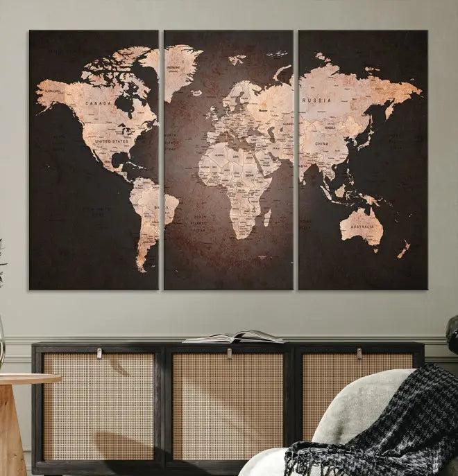 A World Map Canvas Print with a vintage design enhances the dark wall. This three-panel artwork is crafted on museum-quality canvases, gallery wrapped, and features a UV-protective coating for enduring brilliance.