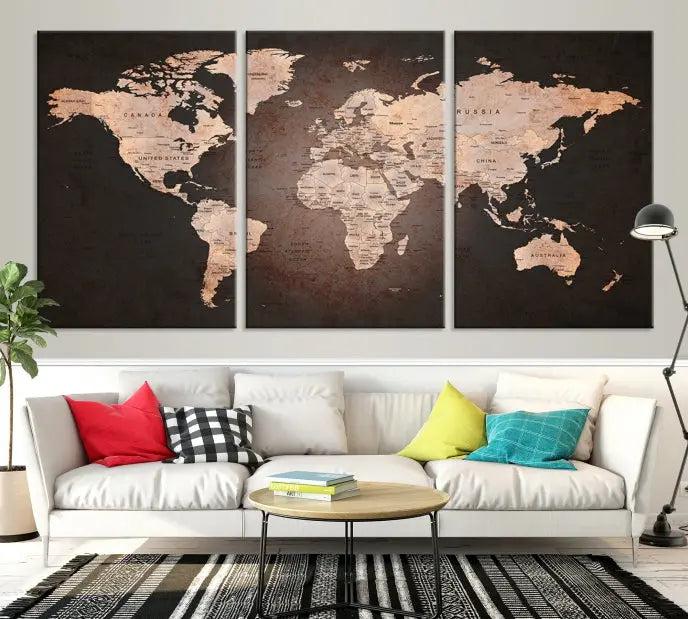 A World Map Canvas Print with a vintage design enhances the dark wall. This three-panel artwork is crafted on museum-quality canvases, gallery wrapped, and features a UV-protective coating for enduring brilliance.