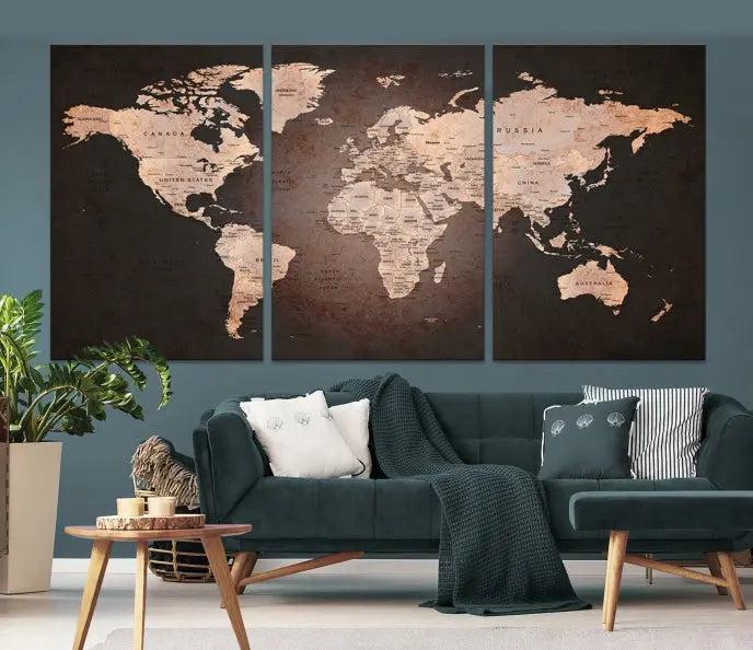 A World Map Canvas Print with a vintage design enhances the dark wall. This three-panel artwork is crafted on museum-quality canvases, gallery wrapped, and features a UV-protective coating for enduring brilliance.