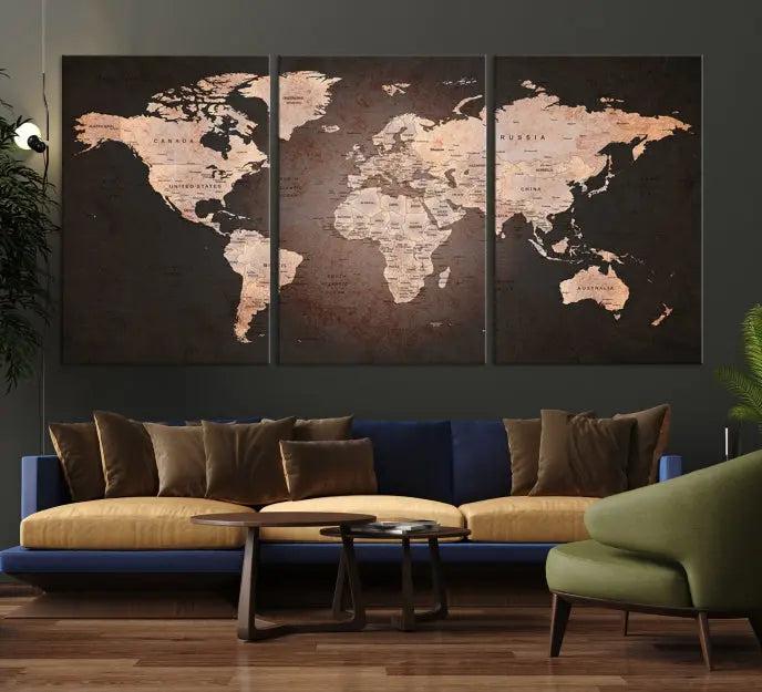 A World Map Canvas Print with a vintage design enhances the dark wall. This three-panel artwork is crafted on museum-quality canvases, gallery wrapped, and features a UV-protective coating for enduring brilliance.