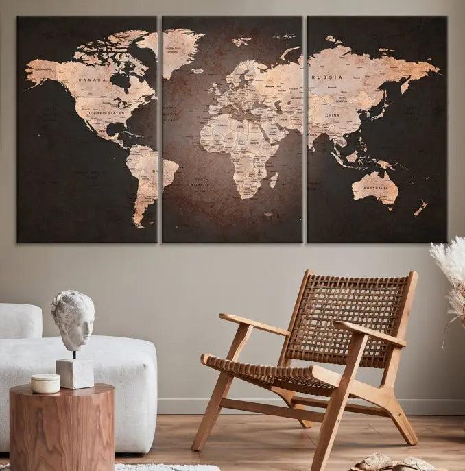 A World Map Canvas Print with a vintage design enhances the dark wall. This three-panel artwork is crafted on museum-quality canvases, gallery wrapped, and features a UV-protective coating for enduring brilliance.