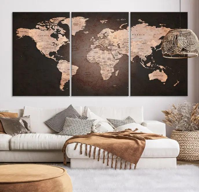 A World Map Canvas Print with a vintage design enhances the dark wall. This three-panel artwork is crafted on museum-quality canvases, gallery wrapped, and features a UV-protective coating for enduring brilliance.