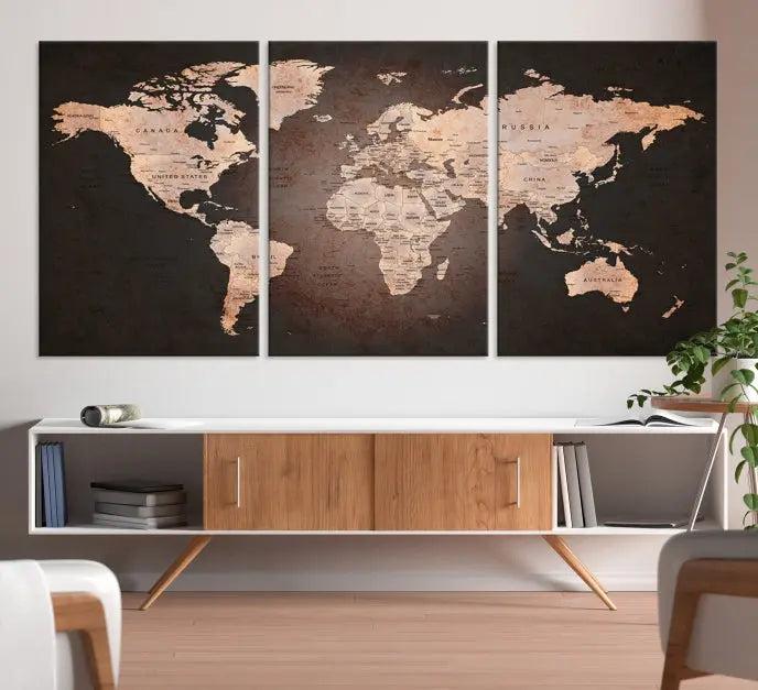 A World Map Canvas Print with a vintage design enhances the dark wall. This three-panel artwork is crafted on museum-quality canvases, gallery wrapped, and features a UV-protective coating for enduring brilliance.