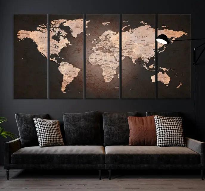 A World Map Canvas Print with a vintage design enhances the dark wall. This three-panel artwork is crafted on museum-quality canvases, gallery wrapped, and features a UV-protective coating for enduring brilliance.