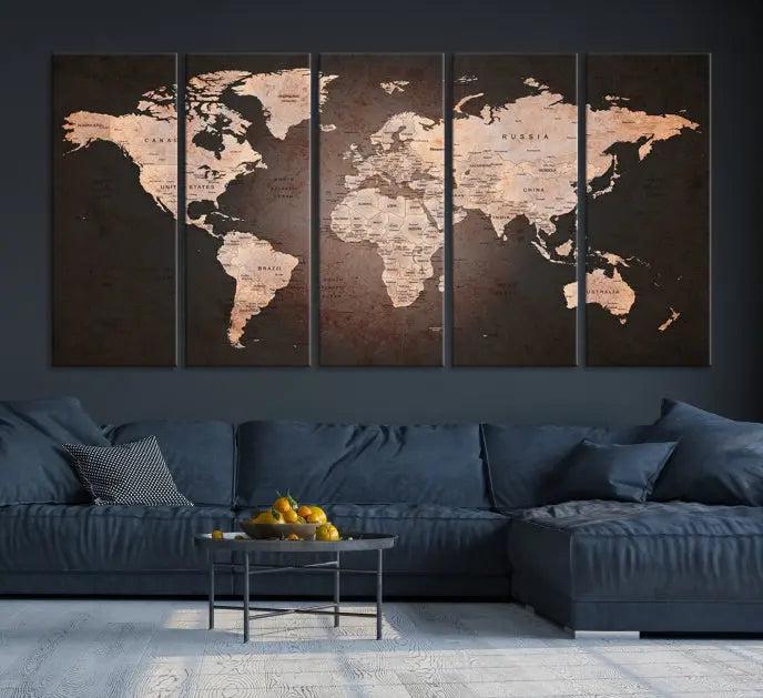 A World Map Canvas Print with a vintage design enhances the dark wall. This three-panel artwork is crafted on museum-quality canvases, gallery wrapped, and features a UV-protective coating for enduring brilliance.