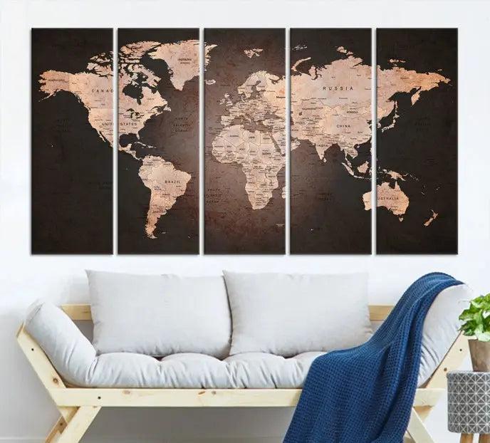 A World Map Canvas Print with a vintage design enhances the dark wall. This three-panel artwork is crafted on museum-quality canvases, gallery wrapped, and features a UV-protective coating for enduring brilliance.