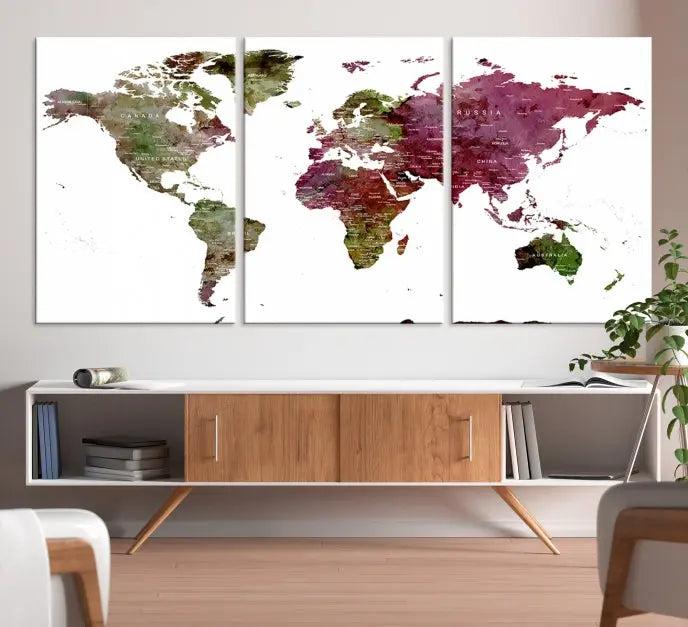 The stylish living room showcases a World Map Canvas Print, a three-panel art piece. Each canvas is gallery wrapped and finished with a UV-protective coating to maintain its vibrant appeal.