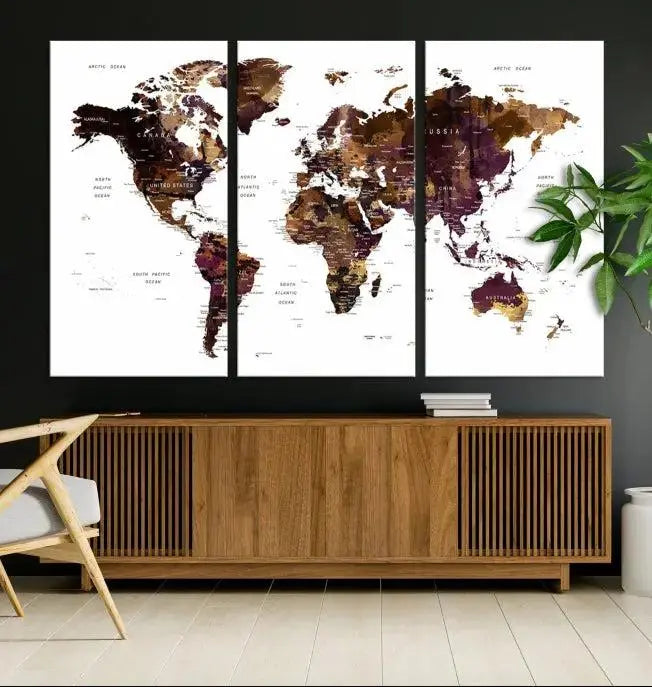 A three-panel World Map Painting Wall Art Canvas Print, crafted on museum-quality canvas with a UV-protective coating, is displayed in this modern living room. It's ready to hang, adding a sophisticated touch to the stylish space.