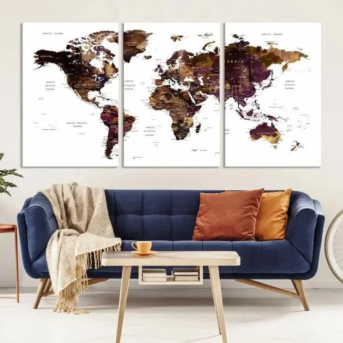 A three-panel World Map Painting Wall Art Canvas Print, crafted on museum-quality canvas with a UV-protective coating, is displayed in this modern living room. It's ready to hang, adding a sophisticated touch to the stylish space.