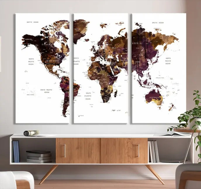 A three-panel World Map Painting Wall Art Canvas Print, crafted on museum-quality canvas with a UV-protective coating, is displayed in this modern living room. It's ready to hang, adding a sophisticated touch to the stylish space.