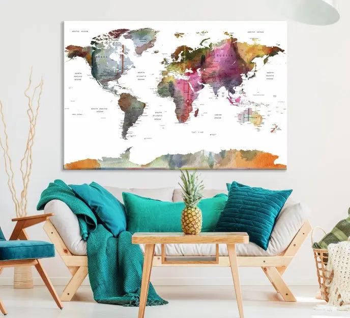 A set of three "World Map Push Pin Travel Canvas Prints" in vibrant colors adorns the dark wall.