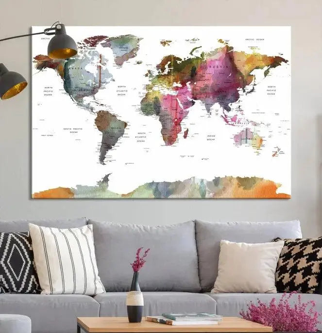 The wall is adorned with a three-panel World Map Wall Art Canvas Print. These museum-quality canvases are gallery wrapped for an elegant finish, and their UV-protective coating ensures the vibrant details will be preserved for years to come.