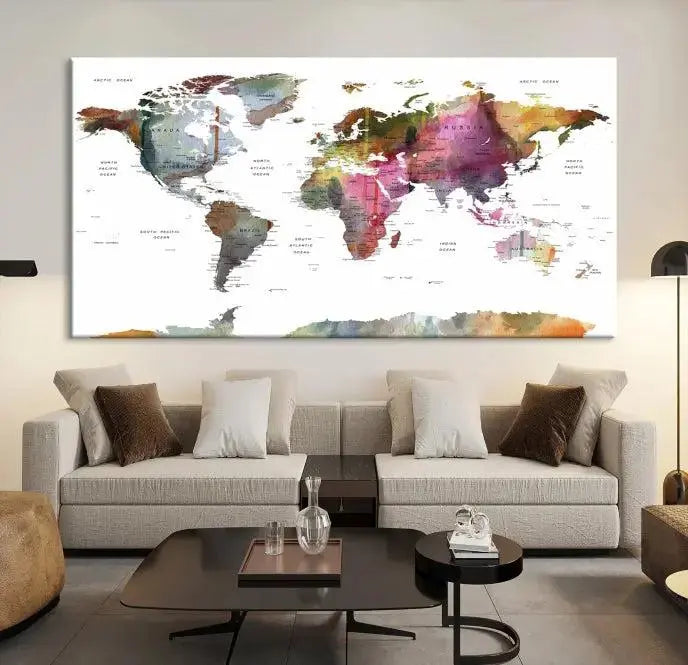 The wall is adorned with a three-panel World Map Wall Art Canvas Print. These museum-quality canvases are gallery wrapped for an elegant finish, and their UV-protective coating ensures the vibrant details will be preserved for years to come.