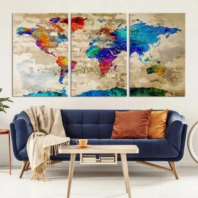 A museum-quality World Map Wall Art Canvas Print with vibrant colors and UV protection coating hangs prominently in a modern living room.