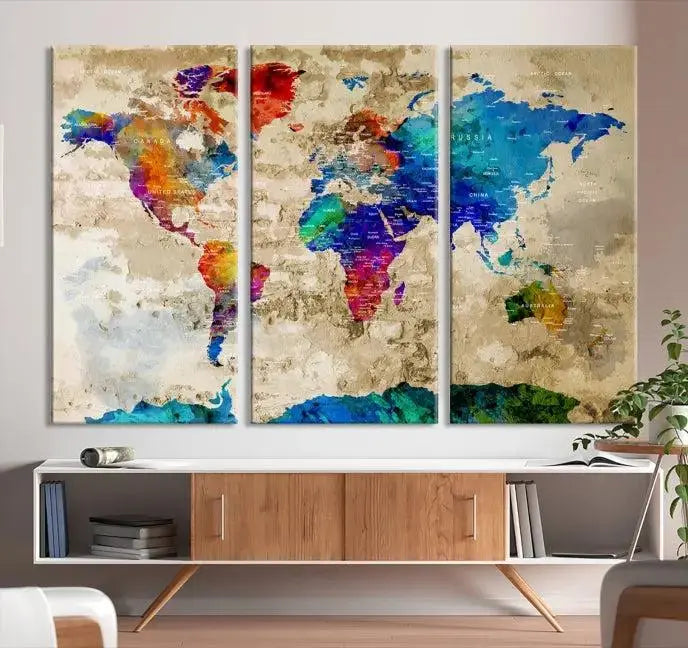 A museum-quality World Map Wall Art Canvas Print with vibrant colors and UV protection coating hangs prominently in a modern living room.