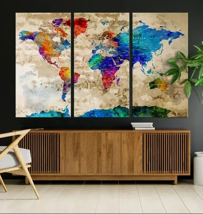 A museum-quality World Map Wall Art Canvas Print with vibrant colors and UV protection coating hangs prominently in a modern living room.