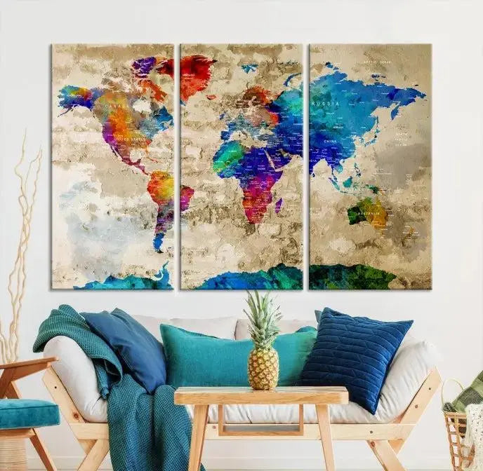 A museum-quality World Map Wall Art Canvas Print with vibrant colors and UV protection coating hangs prominently in a modern living room.