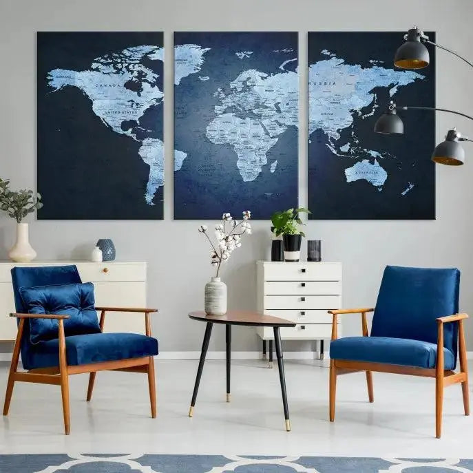 A modern living room featuring a World Map Wall Art Canvas Print in triptych format.