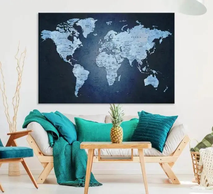 A modern living room featuring a World Map Wall Art Canvas Print in triptych format.